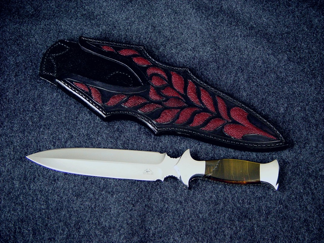 "Classic" Dagger, obverse side view in 440C high chromium stainless steel blade, 304 stainless steel bolsters, Blue/Gold Tigereye gemstone handle, red Stingray skin inlaid in hand-carved leather sheath