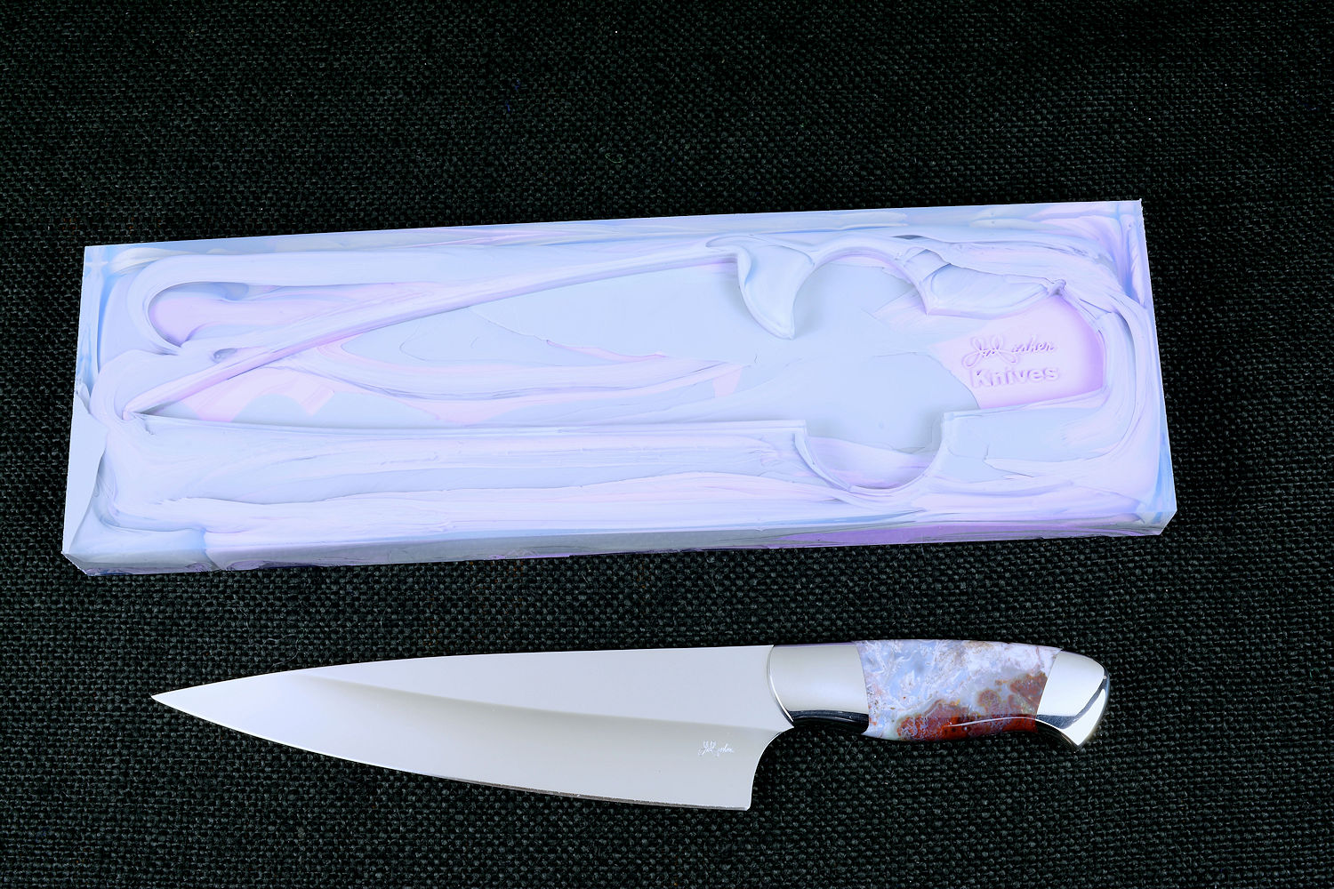 "Corvus" Custom Chef's Knife, obverse side view,  in T3 Deep cryogenically treated 440C high chromium martensitic stainless steel blade, 304 stainless steel bolsters, Bay of Fundy Agate Fossil gemstone handle, hand-dyed, hand-cast silicone prise