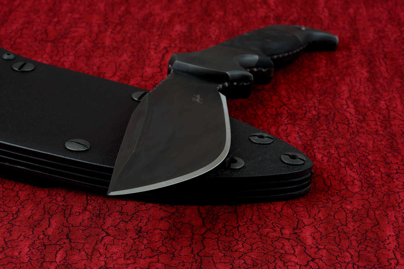"Hooded Warrior" (Shadow Line) reverse side view in 440C high chromium stainless steel blade, 304 stainless steel bolsters, black G10 fiberglass/epoxy composite handle, locking kydex, anodized aluminum, stainless steel sheath