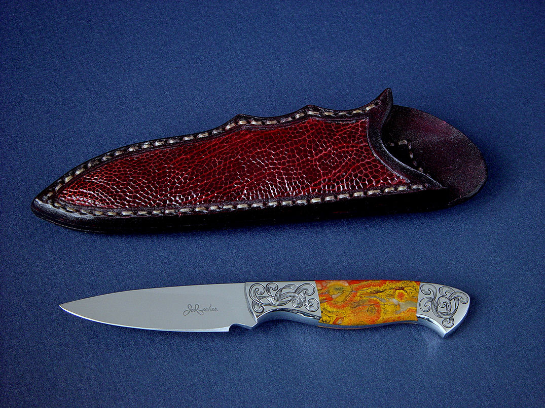 "Nekkar" obverse side view in 440C high chromium stainless steel blade, hand-engraved 304 stainless steel bolsters, Morgan Hill Poppy Jasper gemstone handle, Ostrich leg skin inlaid in hand-carved leather sheath