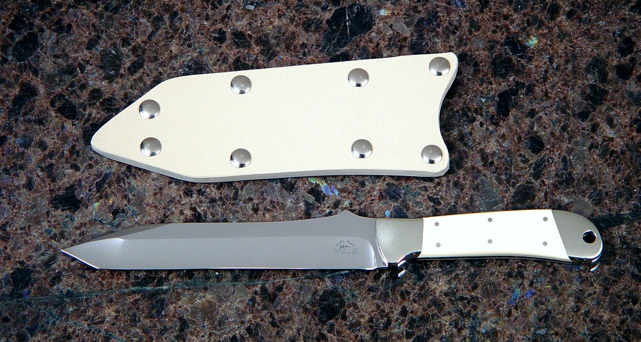 "Tharsis" chef's knife, obverse side view in 440C high chromium stainless steel blade, nickel silver bolsters, ivory micarta handle, slip sheath of kydex, nickel plated steel