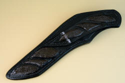 "Arcturus" sheath back view. multiple inlays of shark skin in thick, heavy leather shoulder, hand-stitched 