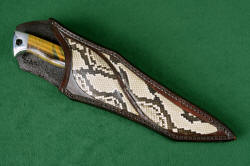 "Argyre" sheathed view. Sheath is deep and protective, with beautiful inlay panels of Python skin in heavy leather shoulder.