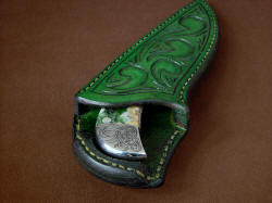 "Bootes ST" sheath mouth view. To remove knife, push down on butt welt and pull knife. 