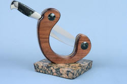"Concordia" reverse side view. Beautiful knife is held steady and firm with heavy granite base