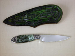 "Deneb" reverse side view. Full carving, tooling and hand-dying on the sheath back and belt loop for a complete piece of art