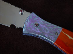 "Elysium" obverse side front bolster detail. Bolsters are hand-engraved and anodized titanium