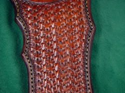 "Flamesteed" sheath detail: tooling pattern is complex weave and tucked basketweave. 
