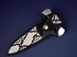 "Grim Reaper" python sheathed view. Striking python pattern in large panel inlays in hand-carved leather sheath