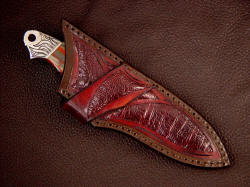 "Grus" Sheath detail. Note crossdraw and inlays of burgundy ostrich skin in hand-carved leather