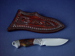 "Grus" reverse side view. Sheath has tough hand-carved belt loop and border tooled sheath back