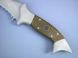 "Halius" obverse side handle detail. Note sculpted front bolster face, full width bolsters at thumb rise and front quillon, angle of fishtail butt for skull crusher talon application. Tiger stripe G10 is color fast throughout material and very tough and resiliant.