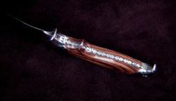 "Hooded Warrior" inside handle edgework, filework detail. Filework style: "wrenches" 