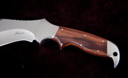 "Hooded Warrior" handle detail, obverse side. Exotic hardwood: Kingwood