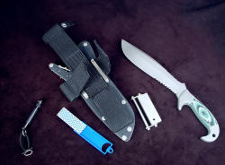 "Imamu" sheath accessory view. Accessories include diamond pad sharpener, magnesium/firesteel fire starter, Maglite solitaire flashlight with all stainles steel fittings