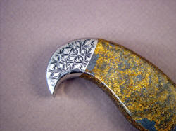 "Iraca" handmade fine knife, reverse side rear bolster detail. Note beautiful golden color with metallic hematite in gemstone handle.