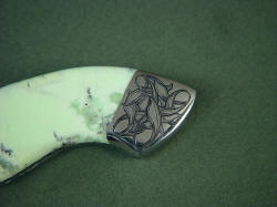 Izanami gemstone handled knife obverse side rear bolster engraving. 304 stainless steel engraving lasts indefinitely.