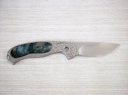 Izar liner lock folding knife reverse view, gemstone handle inlay, interframe