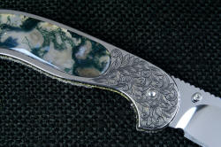 "Izar" linerlock folding knife, reverse side engraving detail. This is a 3.7 power enlargement of the knife!