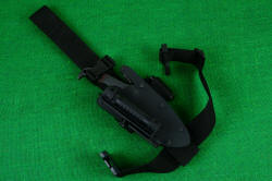 "Kairos" professional counterterrorism tactical knife, shown mounted on EXBLX belt loop extender with thigh strap