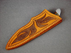 "La Cocina" kitchen knife has a deep and protective leather sheath, in heavy hand-carved and tooled leather shoulder