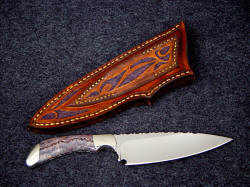 "La Cocina" chef's kitchen knife for fruits and vegetables, smaller chores. Note the beautful thin hollow grind, the striking gemstone handle, and the sheath tooling and carving on the back