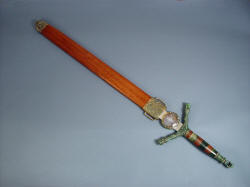 "Lycaon" sheathed view (also called scabbard), with cast bronze chape, bronze fittings, handle of jade and exotic guayabillo hardwood