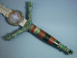 "Lycaon" obverse side hilt view showing fittings and handle made in cast bronze, agate with bronze bezel on ricasso, jade handle and guayabillo hardwood handle