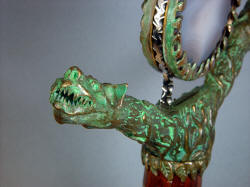 "Lycaon" guard casting detai in green verdigris aged hand-cast silicon bronze crossguard, tang filework, unique handmade fittings