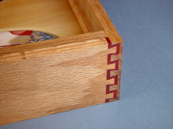 "Macha Navigator" case joinery detial. Double dovetail in Red Oak and Redheart exotic hardwood, lacquered and sealed