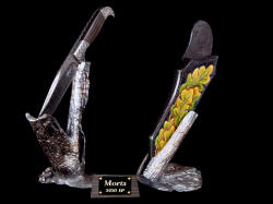 "Morta" front left view. Knife sculpture with damascus blade knife on stand and hand-carved leather sheath on bronze stand