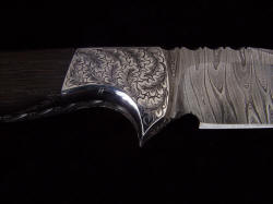 "Morta" reverse side front bolster detail. bolsters are contoured polished, finished, and surfaces hand-engraved stainless steel