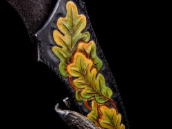 "Morta" sheath and stand detail. Hand-dyed leather to reflect turning oak leaves and cycle of life