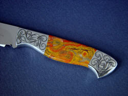 "Nekkar" obverse side handle detail. Nice ribbon engraving compliments bolsters and echos orbicular pattens in jasper gemstone knife handle scales