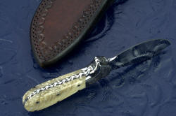 "Nunavut" skinning knife, inside handle tang view. Bolsters are dovetailed for security, through-tang pins bed handle scales to tang