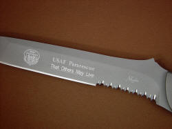 "PJ" obverse side blade engraving detail. Engraving is diamond stylus cut in bead blasted stainless tool steel, serrations are my Vampire rip tooth for tough cutting chores