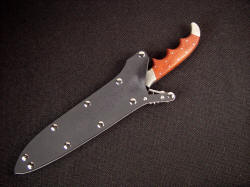 Patriot-Boar combat knife, sheathed detail. Positively locking waterproof sheath has stainless mechanism.