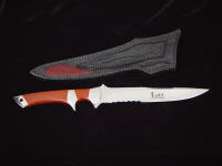 "Patriot" custom knife, reverse side view. Knife is custom etched with 2.5" of angled serrations.