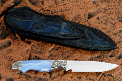 "Perseus" reverse side view. Sheath back and belt loop are hand-carved and hand-dyed to match front and knife bolster engraving