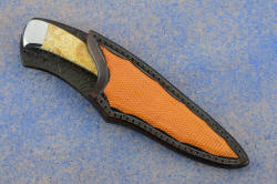 "Phact" sheathed view. Sheath has high protective back for wearer, yet plenty of display for handle and easy access.