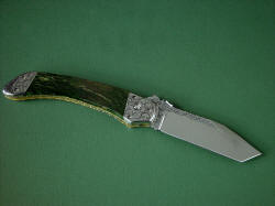 "Procyon" reverse side view. Entire knife, blade, spine, fittings, bolsters, liners are all embellished throughout
