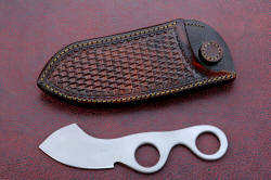 "Random Access Three," obverse side view with horizontal wear sheath, front side. Rear ring of knife handle engages leather stud that retains the knife in the sheath even in activity, until needed.