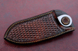 "Random Access Three" sheathed view, horizontal sheath. Knife is retained in sheath with leather stud, which has to be depressed in order for knife to be removed. Secure wear for middle of back or front side right.