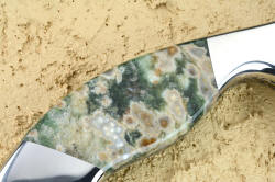 "Sirona" fine handmade chef's knife, reverse side handle detail. Green Orbicular agate has white orbs floating in sea-green transparent agate, smoothed, rounded and polished for comfort