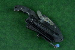 "Skeg" tactical, counterterrorism professional knife, shown with HULA standard mount. The articulating flashlight holder folds tightly against the sheath for compact wear
