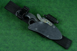 "Skeg" tactical, counterterrorism professional knife, rigged with the UBLX, Ultimate Belt Loop Extender that allows a lower position of the knife handle below the belt line