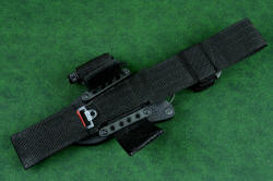 "Skeg" tactical, counterterrorism professional knife, shown with UBLX hook and loop straps open, black stainless steel mounting bars fixing UBLX to the sheath