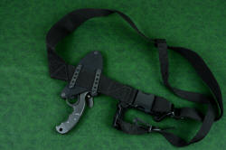 "Skeg" tactical, counterterrorism professional knife, mounted to sternum harness, back side showing mounting arrangement using stainless steel flat bars. Vertical aluminum mounting straps can also be used in this mounting arrangement. 