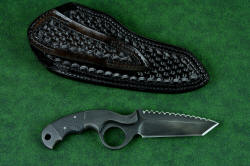 "Skeg" tactical, counterterrorism professional knife, reverse side view with leather sheath back. Sheath is tooled in back and belt loop; belt loop is double-row stitched for durability