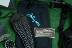 "Skeg" tactical, counterterrorism professional knife, complete set vignette of black basketweave leather sheath, denim storage, engraved detail plate